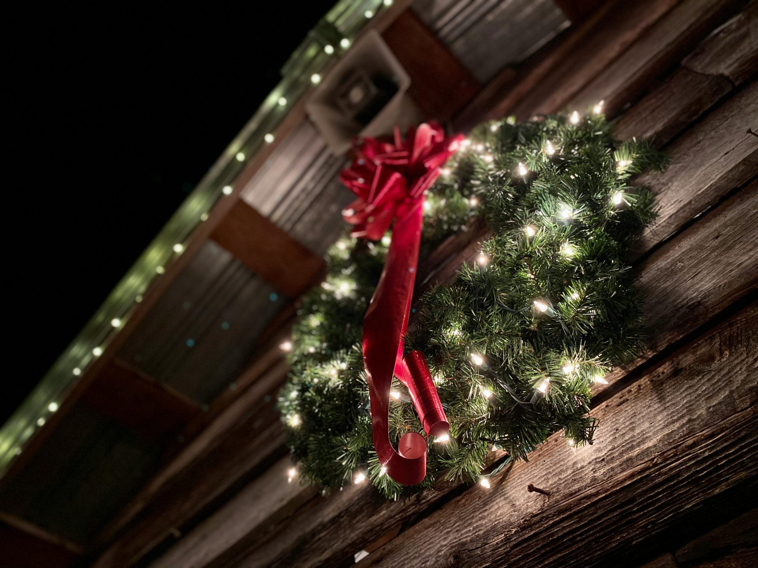 Roseville-christmas-wreath-hanging this image shows Christmas wreath hanging in Roseville, CA
